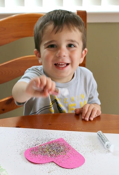 Toddlers love sprinkling glitter on the glue!