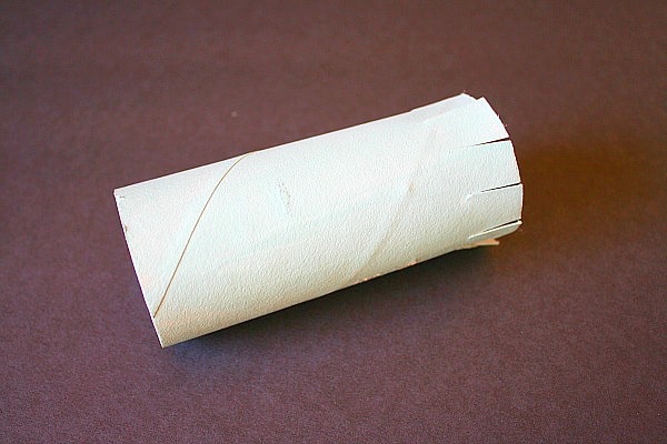 cut slits in toilet paper roll