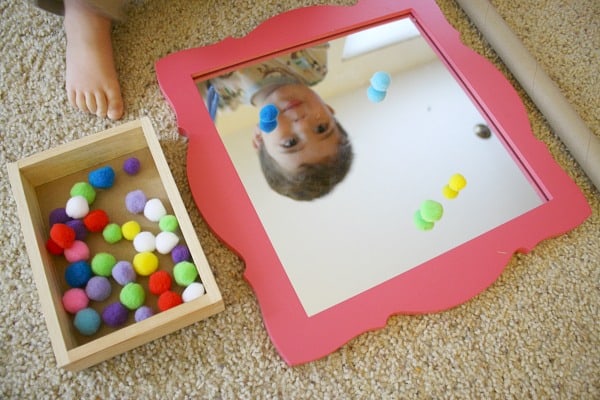 Toddler Activities: Fine Motor Play with Pompoms, Tweezers, and a Mirror