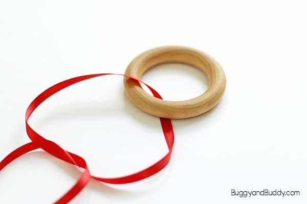tie the ribbon to the wooden ring