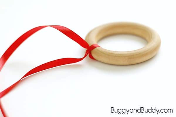 tie the ribbon to the wooden ring