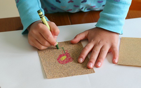creating art with crayons and sandpaper