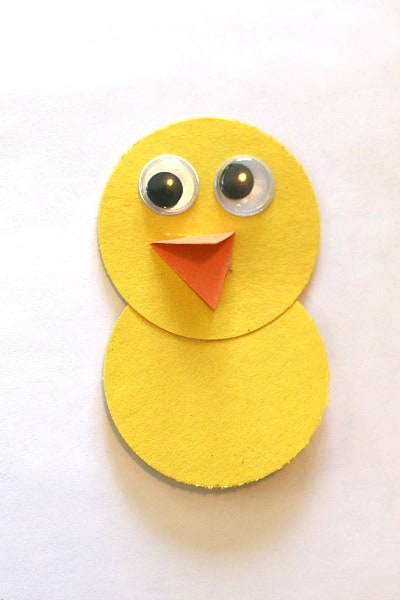 add googly eyes and beak to bird craft for kids