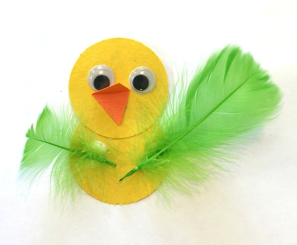 add feathers to paper bird craft for kids