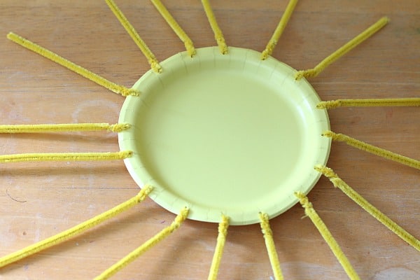 Twist pipe cleaners onto paper plate to create sun craft