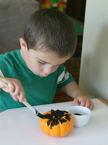 Paint your pumpkin with black paint.