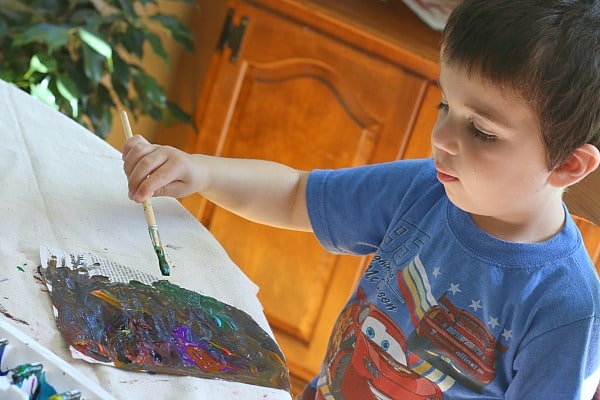 painting on newspaper with preschoolers