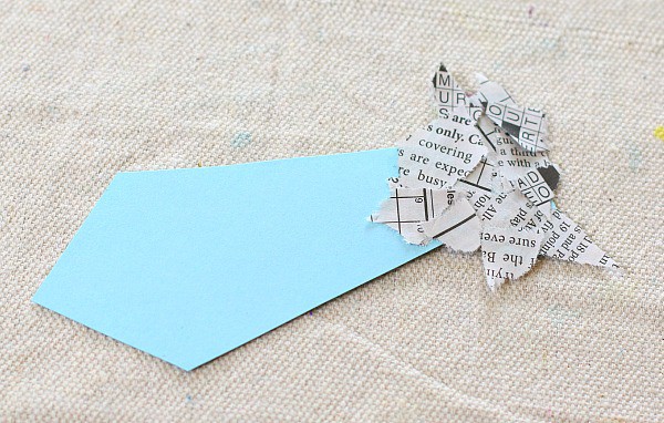 glue the torn newspaper onto your bookmark