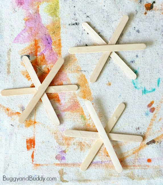 glue together three popsicle sticks to make your spiderwebs