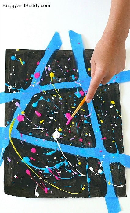 splatter paint over your painted paper
