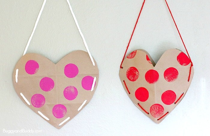 Heart Valentine Holder made from an old brown paper grocery bag! (We decorated our with sponge stamping and laced up the sides!) ~ BuggyandBuddy.com