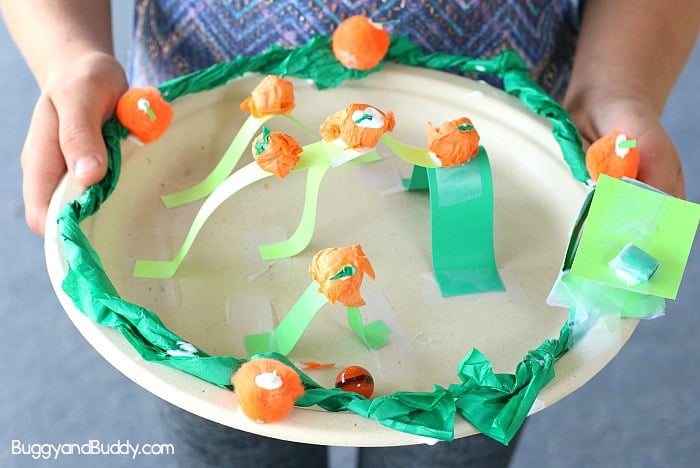 Halloween STEM Challenge for Kids: Make a pumpkin patch themed paper plate marble maze.