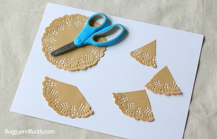 cut your paper doily for your christmas tree craft