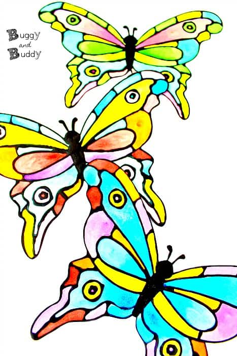 Colorful Painted Paper Butterfly Craft with free template using black glue and watercolors- looks like faux stained glass!