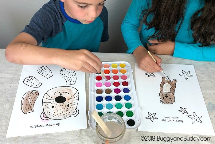 paint your sea otter template with watercolor paint