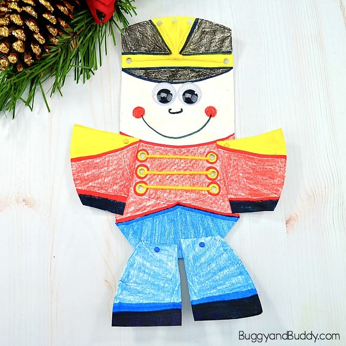 Moveable Paper Plate Nutcracker Craft for Kids for Christmas with Yarn Lacing